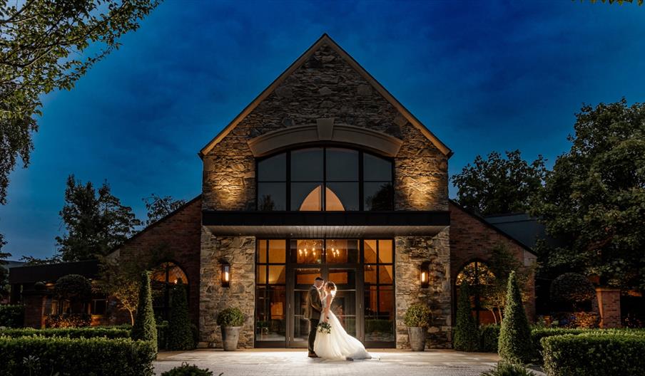 Wedding couple outside Clandeboye Lodge