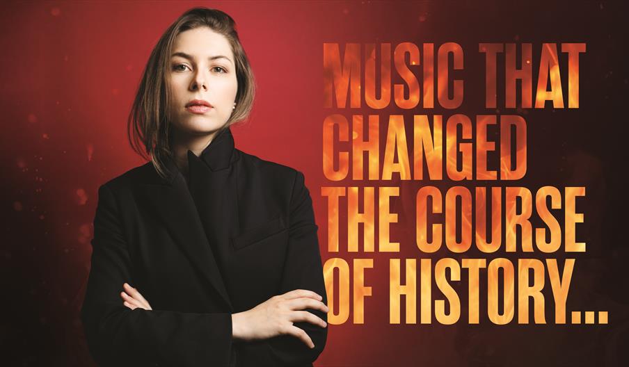 Conductor, Anna Handler stands in front of a red firey background with her arms crossed. There is text that says "Music that changed the course of his