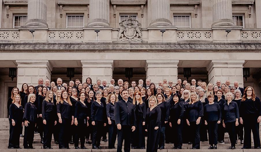 Belfast Philharmonic Choir stand in front of Stormont