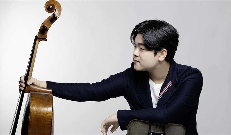 Cellist, Jaemin Han, holds his cello