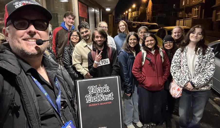 A tour group attending Black Belfast: Queen's Quarter - horror & true crime walking tour by Alternative Ulstours