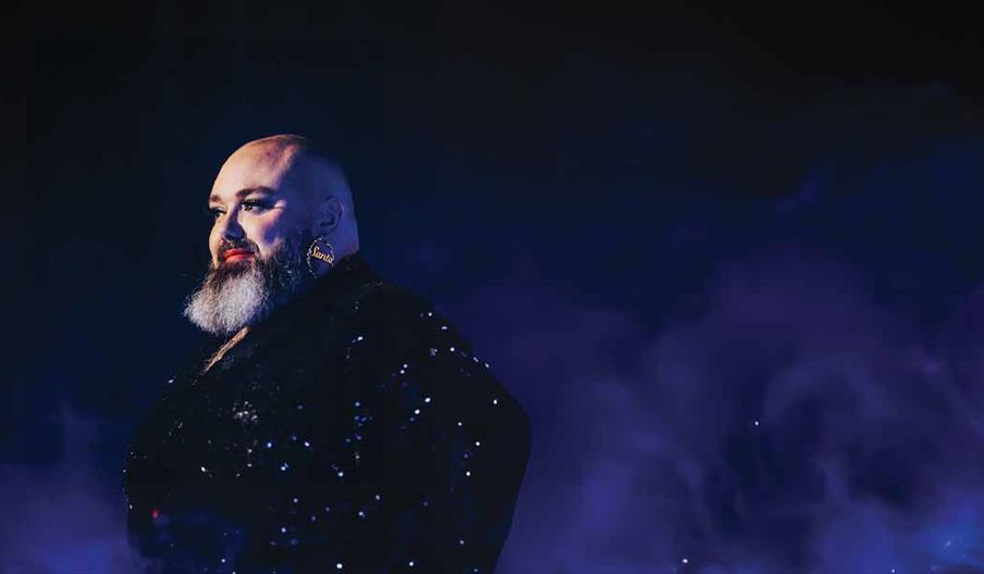 Bearded man in sparkly blazer