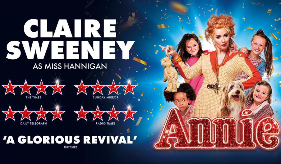 Theater poster for Annie featuring Claire Sweeney as Miss Hannigan with five-star reviews and children with a dog on a bright blue background.