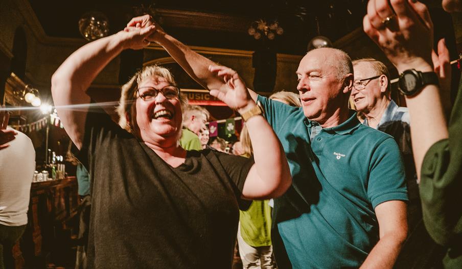 A man and a woman dancing