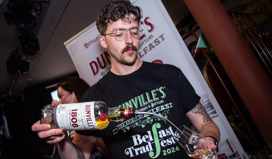 A man pouring whiskey