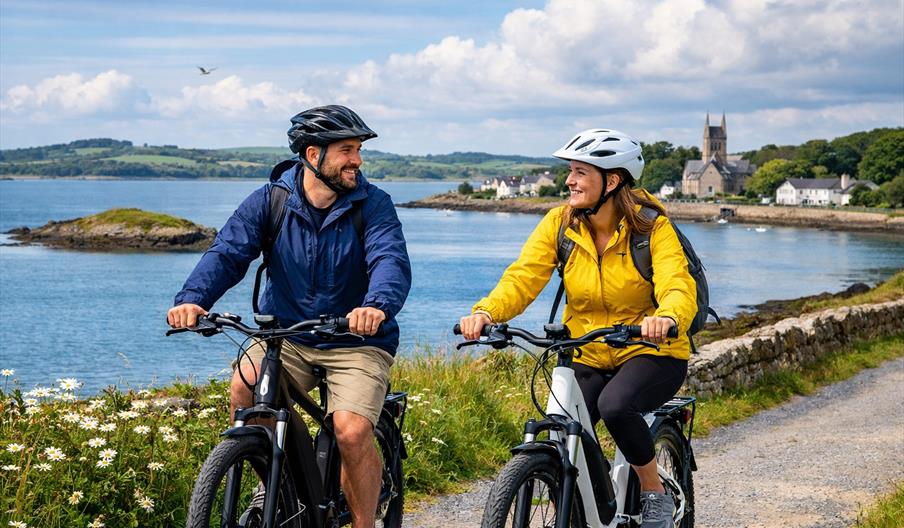 A couple cycling their bikes
