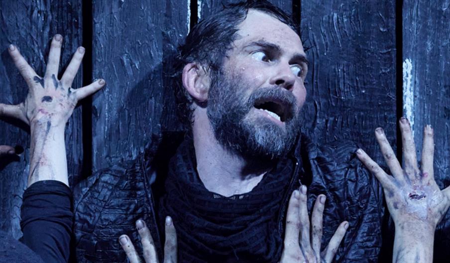 Macbeth receives an ominous message from three witches