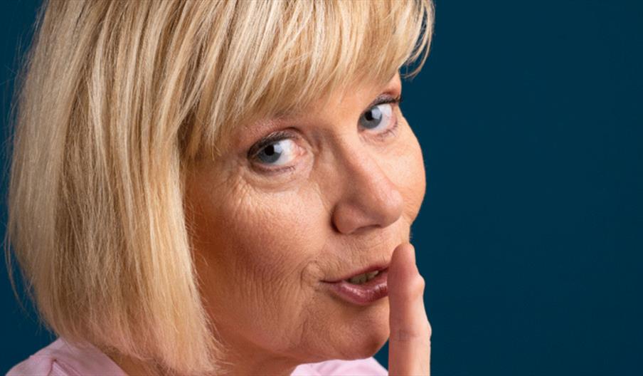 A picture of Nuala McKeever with her fingers to her lips.