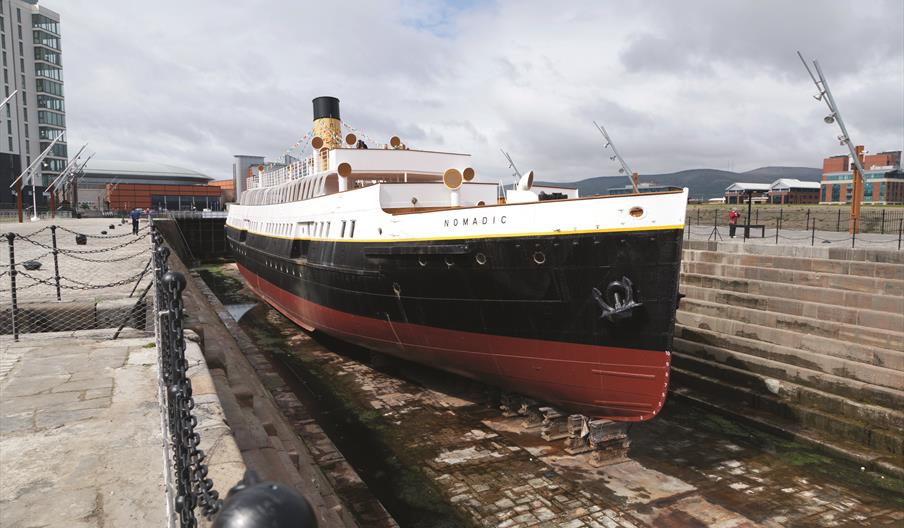Image of SS Nomadic vessel in the docks, taken from the front end of the ship.