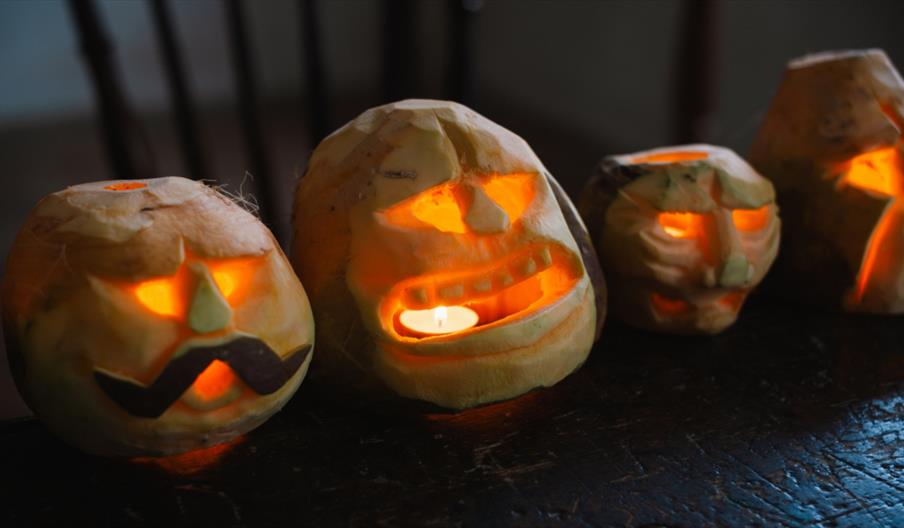 Three turnips carved for Halloween