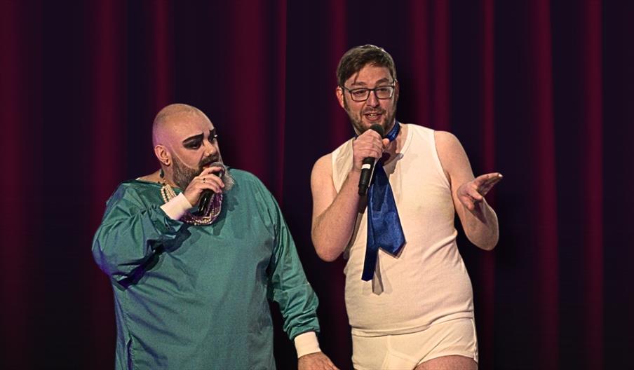 two cabaret performers dressed as part of rocky horror cast