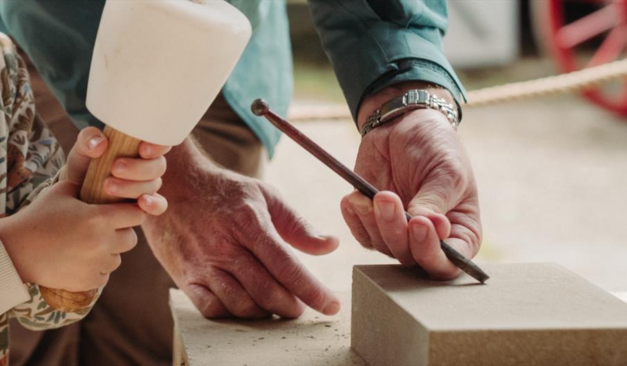 Learn to carve stone at the Ulster Folk Museum