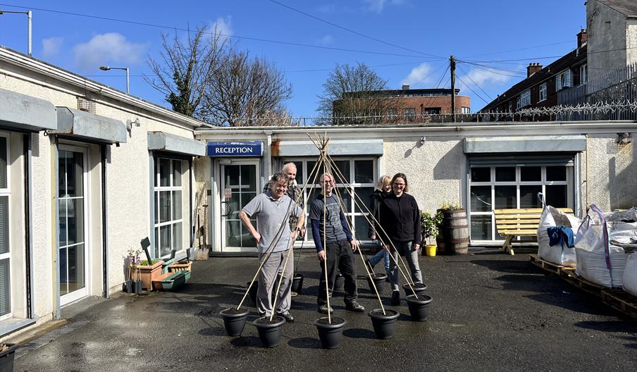 Volunteers working together in The Juke Yard community garden in East Belfast.