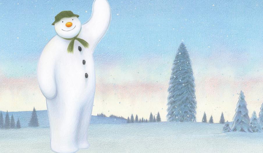 The Snowman stands in a showy wonderland waving