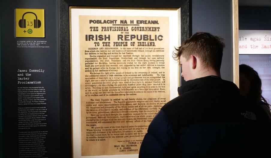A visitor viewing the original 1916 Irish Proclamation, as part of the James Connolly Experience in Áras Uí Chonghailein Áras Uí Chonghaile