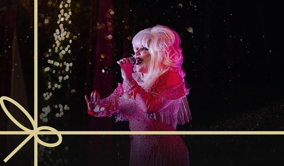 Kirsty Coard as Dolly Parton