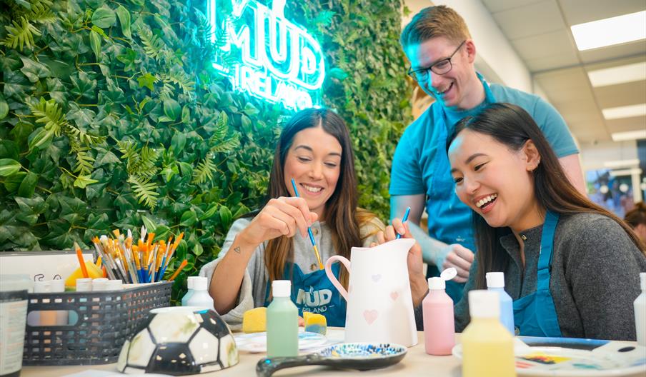 Customers painting pottery at Mud Ireland