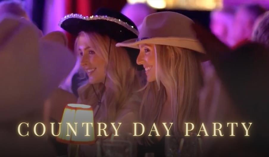 Girls in cowboy hats laughing