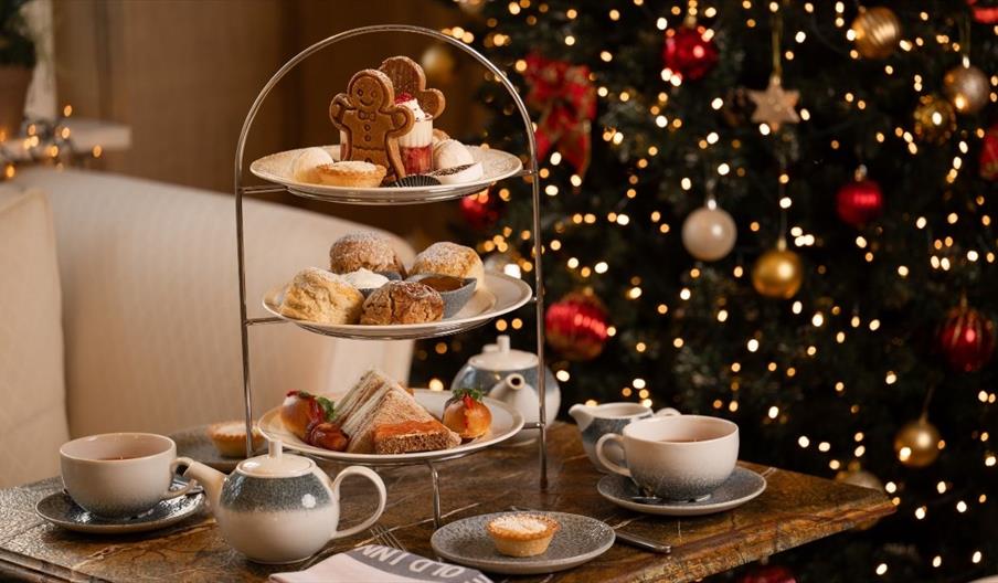 festive afternoon tea in front of christmas tree