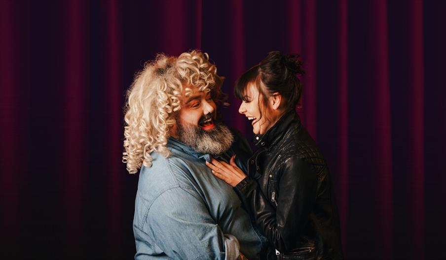two cabaret performers dressed as part of grease