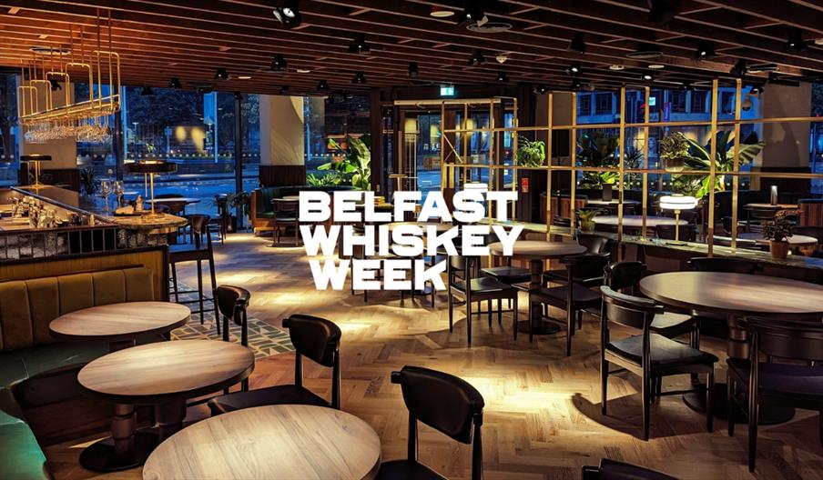 Guests sharing a whiskey dinner at Belfast Whiskey Week