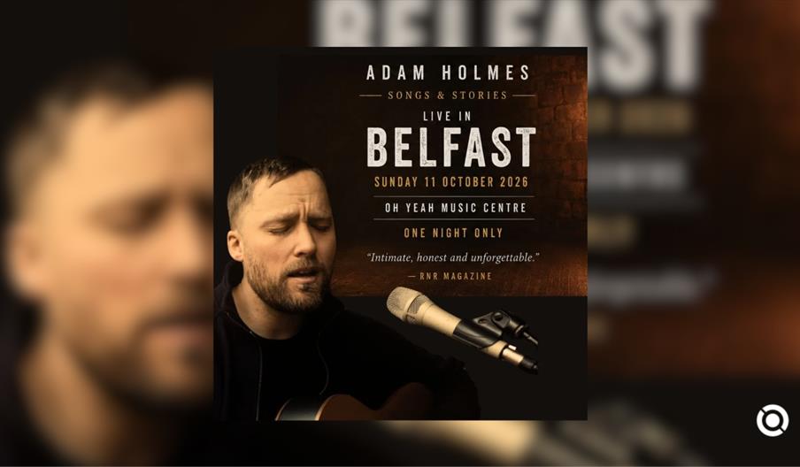 An event poster from the file vb111026.jpg for "**ADAM HOLMES — SONGS & STORIES**."  The design features a dark background split into two main section