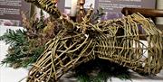 willow stags heads on a trestle table