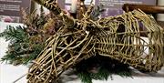 willow stags heads on trestle table