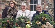 workshop attendees with their completed wreaths