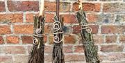 Three finished besom brooms complete with copper curls to ground the broom to the earth