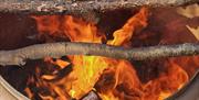 using fire to dry the bark over a brazier