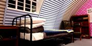 Replica prison bed inside Nissan hut