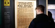 A visitor viewing the original 1916 Irish Proclamation, as part of the James Connolly Experience in Áras Uí Chonghailein Áras Uí Chonghaile